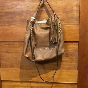 Leather over the shoulder or short strap.